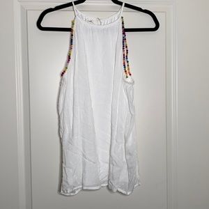 Maurices white tank with colored pompoms